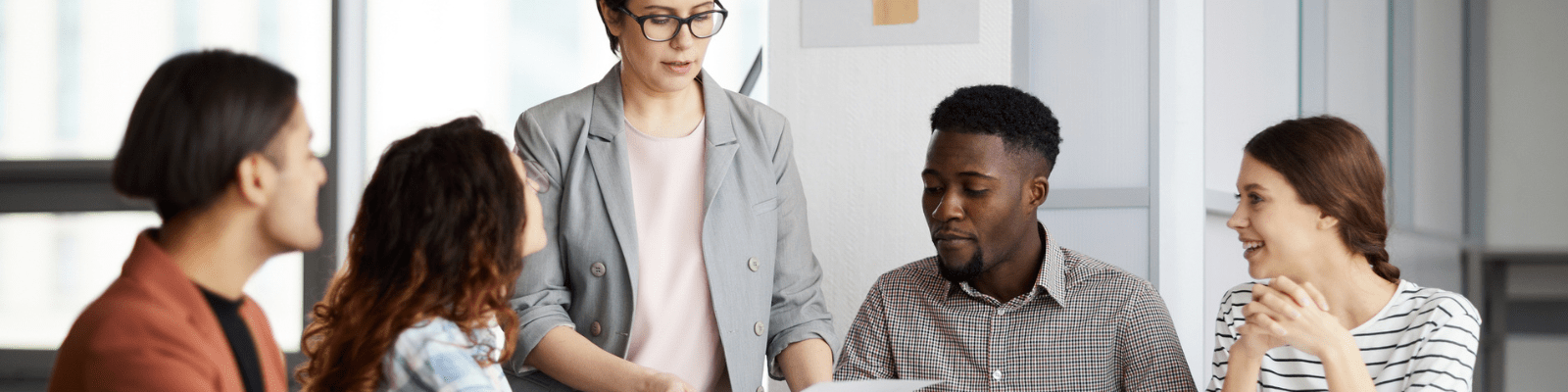 Diverse professional team collaborating during an office meeting.