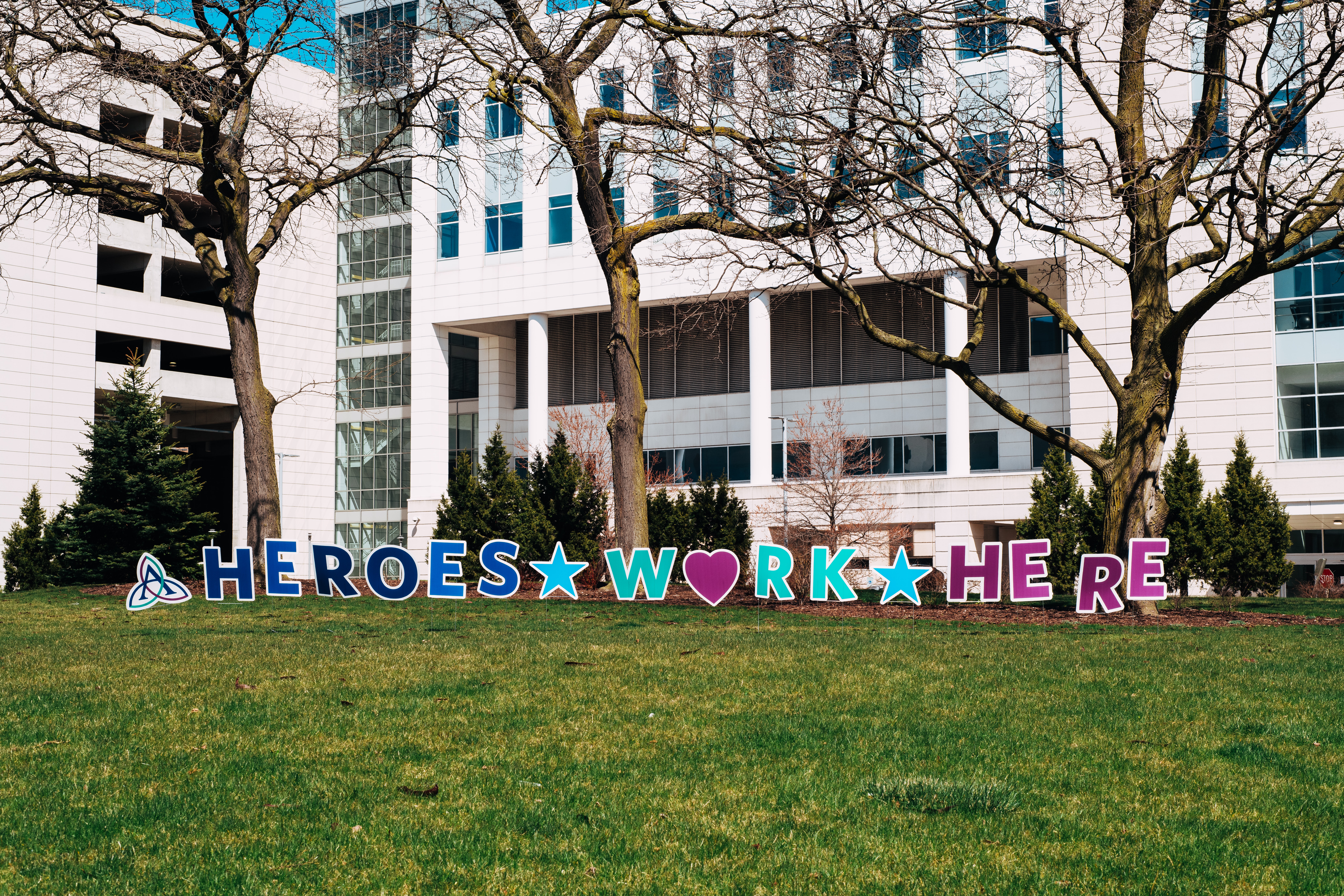 heroes work here sign in front of hospital