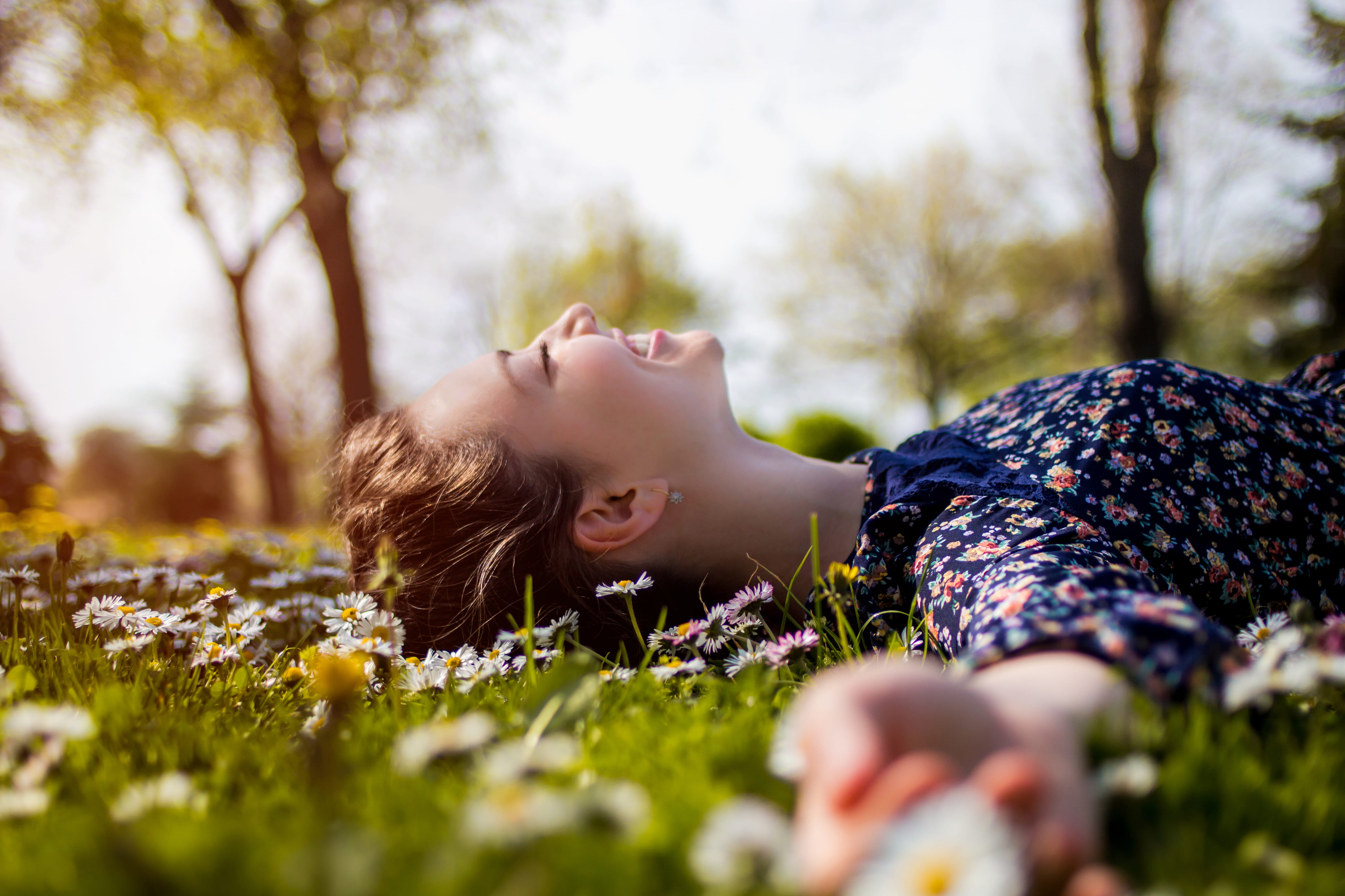 girl in the grass smiling