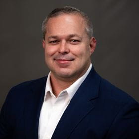 Headshot of Dewayne Rader.