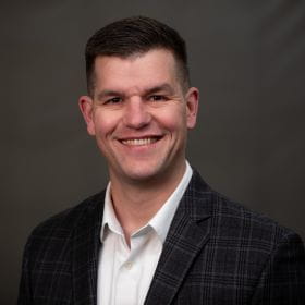 Headshot of Eric Macke.