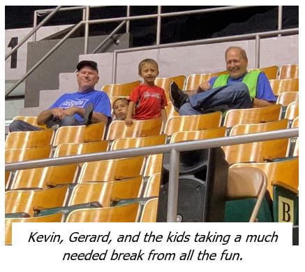 gerard siting with kids in stands